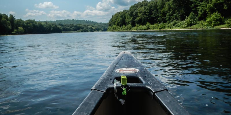 Tip of a canoe in river