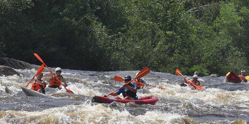 Group kayaking on the river